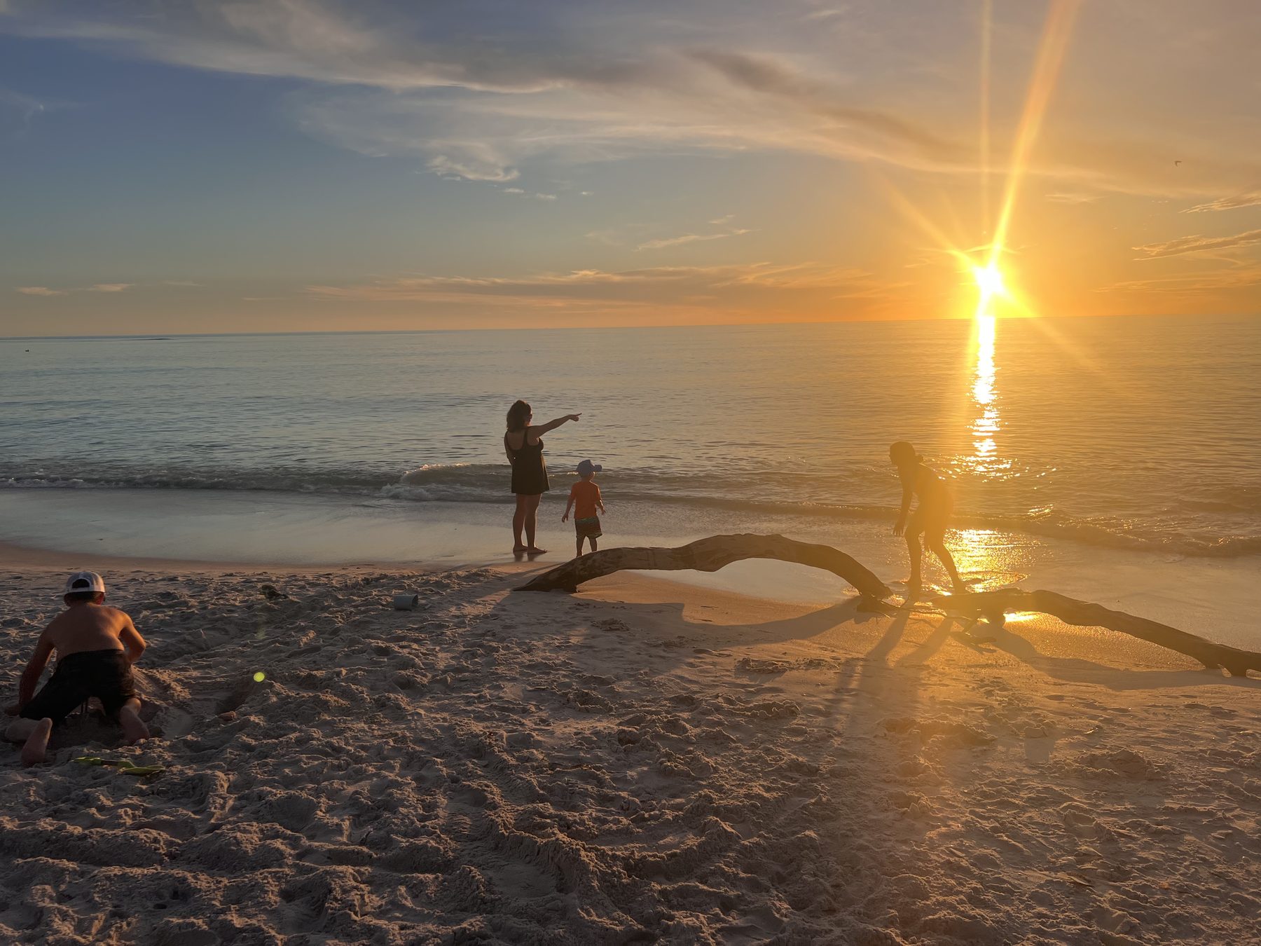 Family at sunset on the beach