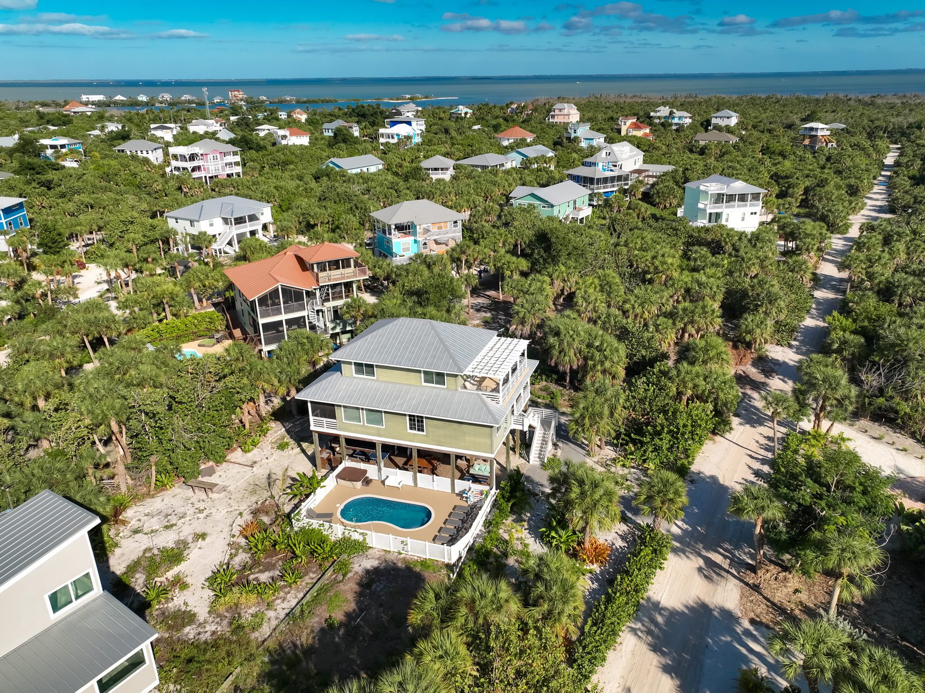 Floridays from above — green stilt home with private heated pool