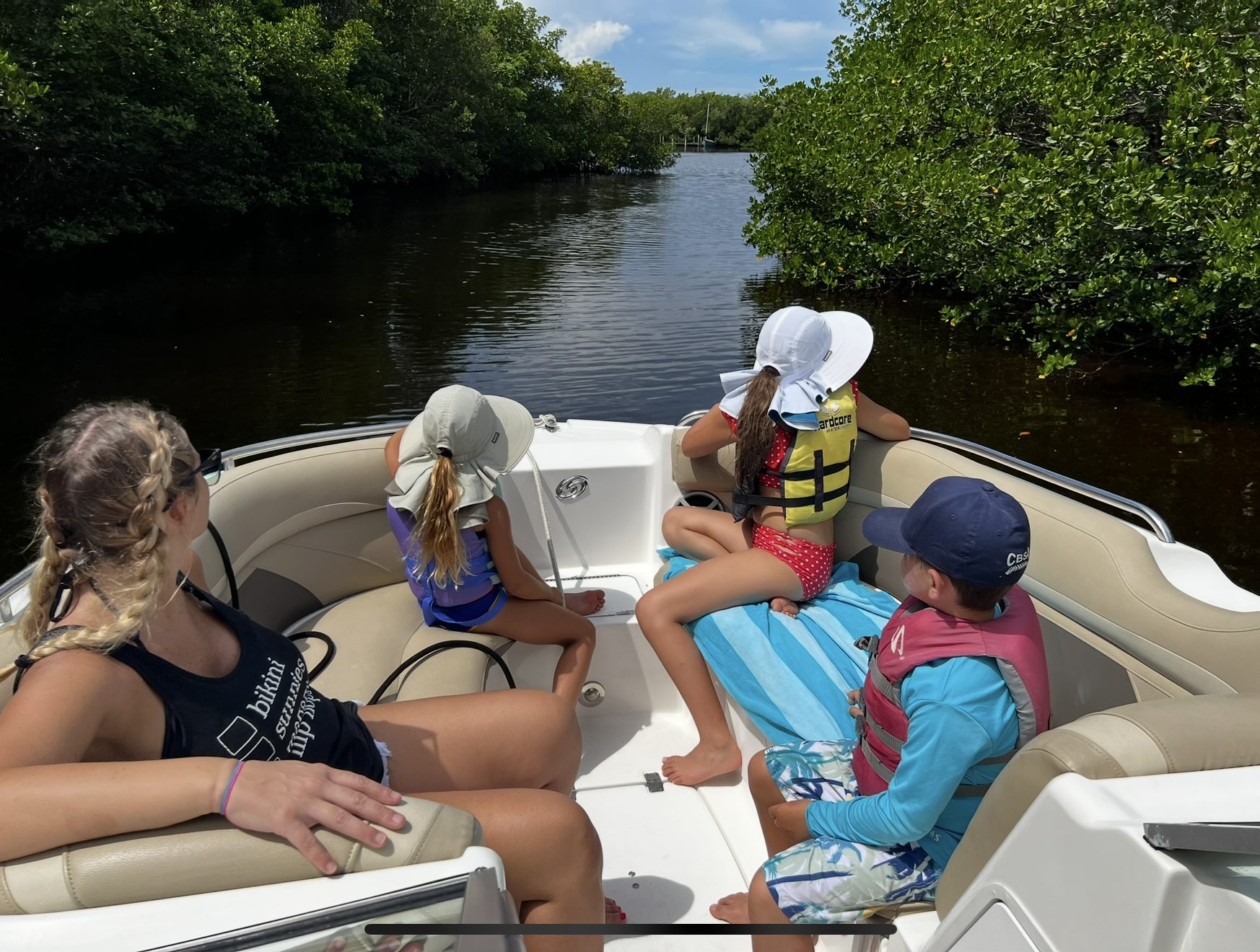 Family boating through the mangroves